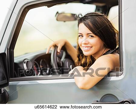 Portrait of young woman during road trip View Large Photo Image Stock Image - Portrait of young woman during road trip. Fotosearch
