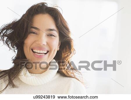 Portrait of young woman laughing View Large Photo Image Stock Photo - Portrait of young woman laughing. Fotosearch
