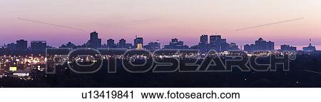 Purple cityscape at sunset View Large Photo Image Stock Image - Purple cityscape at sunset. Fotosearch