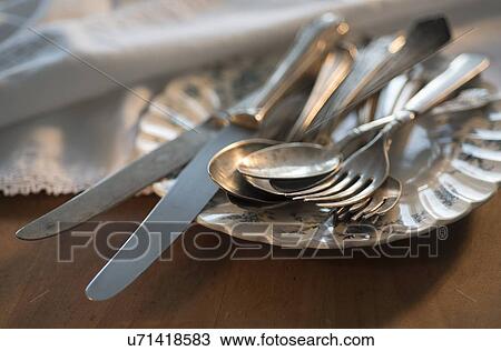 Stock Image - Silver cutlery on wood. Fotosearch