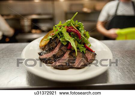Sliced steak with salad View Large Photo Image Stock Image - Sliced steak with salad. Fotosearch