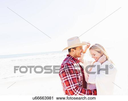 Smiling couple on beach View Large Photo Image Stock Image - Smiling couple on beach. Fotosearch