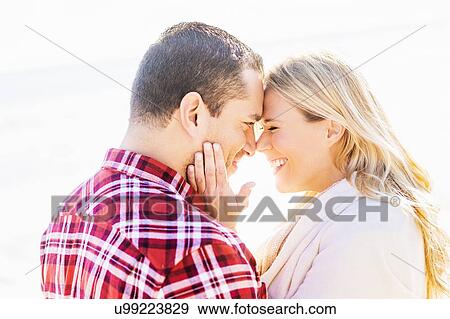 Stock Photo - Smiling couple on beach. Fotosearch