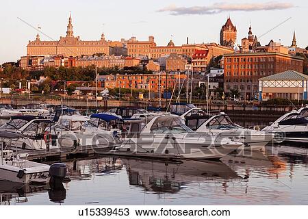 Speedboats moored at marina and cityscape in background View Large Photo Image Stock Image - Speedboats moored at marina and cityscape in background. Fotosearch