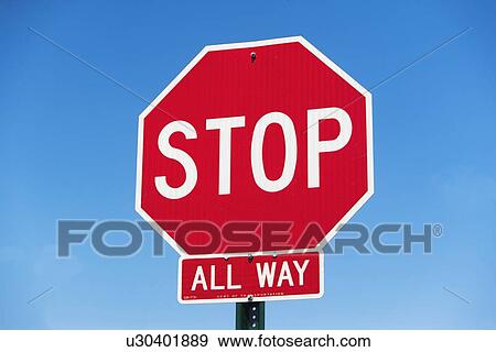Stock Photo - Stop sign on clear sky. Fotosearch
