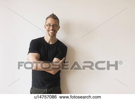 Studio portrait of smiling man View Large Photo Image Stock Photograph - Studio portrait of smiling man. Fotosearch