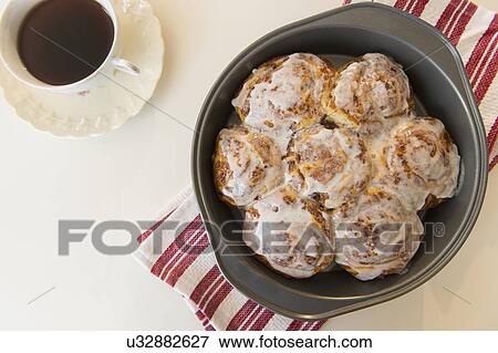 Stock Photo - Studio Shot of cinnamon rolls and coffee. Fotosearch