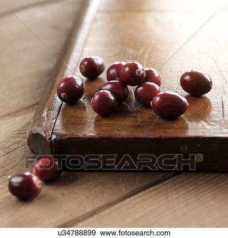 Stock Photo - Studio shot of cutting board and grapes. Fotosearch