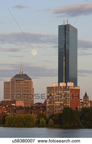 Stock Photo - Supermoon rising over Boston and Charles river. Fotosearch