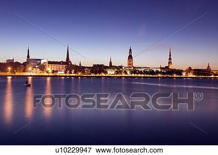 Stock Photo - View of city from river at night. Fotosearch