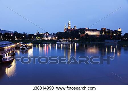 Stock Image - Wawel Royal Castle and Vistula River evening time . Fotosearch