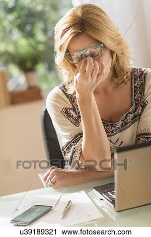 Woman having headache View Large Photo Image Stock Image - Woman having headache. Fotosearch