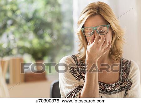 Stock Photography - Woman having headache. Fotosearch