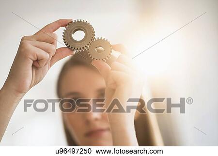 Woman holding parts of engine View Large Photo Image Stock Image - Woman holding parts of engine . Fotosearch