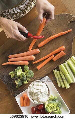Woman preparing vegetables View Large Photo Image Stock Image - Woman preparing vegetables. Fotosearch