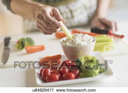Woman preparing vegetables View Large Photo Image Stock Photo - Woman preparing vegetables. Fotosearch
