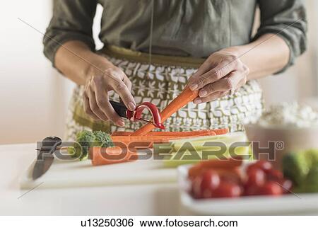 Woman preparing vegetables View Large Photo Image Stock Photograph - Woman preparing vegetables. Fotosearch