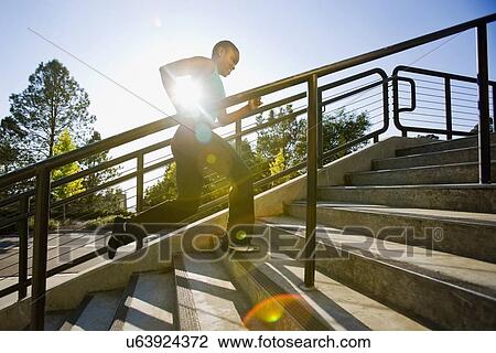 Woman running on steps View Large Photo Image Stock Image - Woman running on steps. Fotosearch