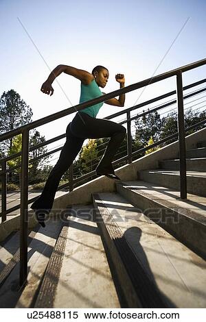Woman running on steps View Large Photo Image Stock Photography - Woman running on steps. Fotosearch