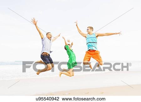 Young people jumping on beach View Large Photo Image Stock Image - Young people jumping on beach. Fotosearch