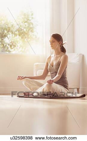 Stock Photo - Young woman practicing yoga . Fotosearch