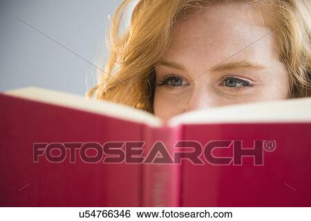 Young woman reading book View Large Photo Image Stock Photograph - Young woman reading book. Fotosearch