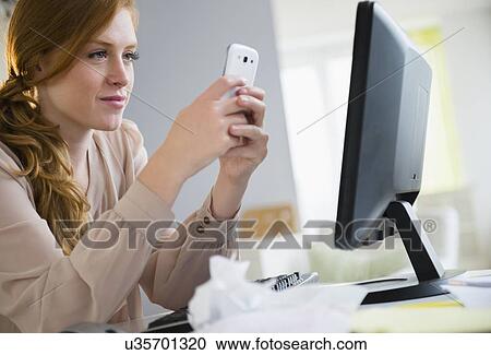 Young woman texting View Large Photo Image Stock Image - Young woman texting. Fotosearch