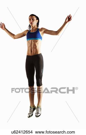 Athlete jumping in mid air View Large Photo Image Picture - Athlete jumping in mid air. Fotosearch