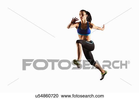Stock Image - Athlete running in mid air. Fotosearch