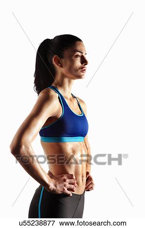 Athlete standing with hands on hips View Large Photo Image Stock Photo - Athlete standing with hands on hips. Fotosearch