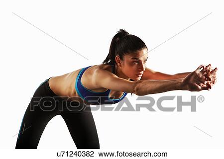 Athlete stretching at waist View Large Photo Image Stock Image - Athlete stretching at waist. Fotosearch