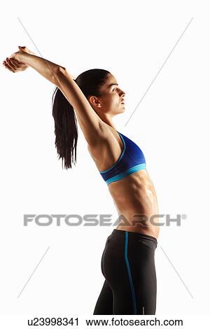 Athlete stretching with hands over head View Large Photo Image Stock Image - Athlete stretching with hands over head. Fotosearch