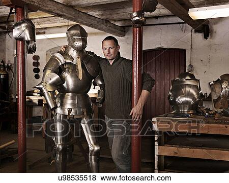 Blacksmith with armor in shop View Large Photo Image Stock Photo - Blacksmith with armor in shop. Fotosearch
