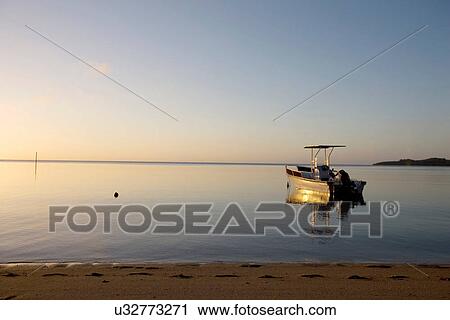 Boat in still ocean View Large Photo Image Stock Image - Boat in still ocean. Fotosearch