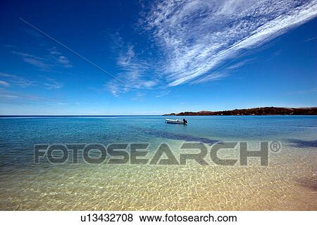 Boat in still ocean View Large Photo Image Stock Photo - Boat in still ocean. Fotosearch