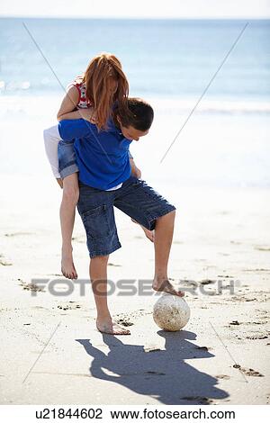 Boy flying toy airplane on beach View Large Photo Image Stock Image - Boy flying toy airplane on beach. Fotosearch
