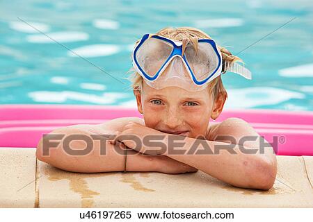 Boy wearing mask in swimming pool View Large Photo Image Stock Photography - Boy wearing mask in swimming pool. Fotosearch