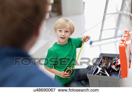Boy with measuring tape and toolbox View Large Photo Image Stock Photo - Boy with measuring tape and toolbox. Fotosearch