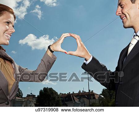 Business people making circle with hands View Large Photo Image Stock Photo - Business people making circle with hands. Fotosearch
