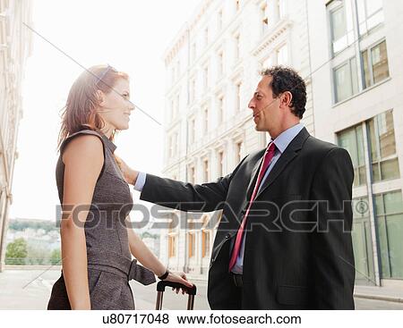 Stock Photo - Business people meeting outdoors. Fotosearch