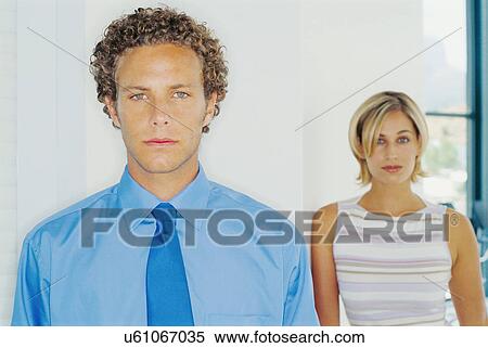 Stock Photography - Business people standing in office. Fotosearch