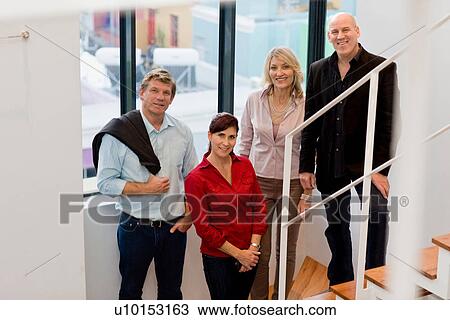 Business people standing on steps View Large Photo Image Stock Image - Business people standing on steps. Fotosearch