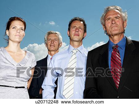 Stock Photo - Business people standing together. Fotosearch
