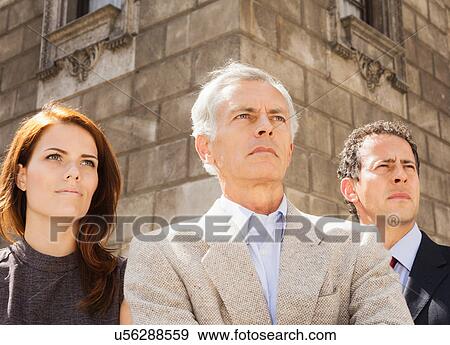 Stock Photo - Business people standing together. Fotosearch