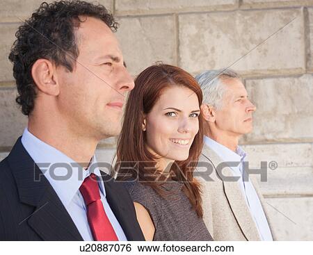 Stock Photograph - Business people standing together. Fotosearch