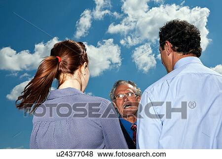 Business people talking against blue sky View Large Photo Image Stock Photo - Business people talking against blue sky. Fotosearch