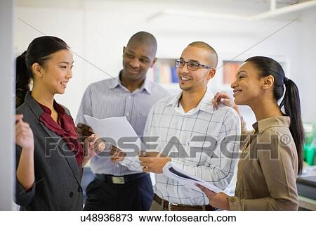 Business people talking in office View Large Photo Image Stock Image - Business people talking in office. Fotosearch