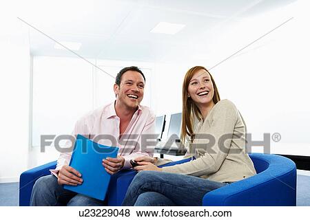 Stock Photo - Business people talking in office. Fotosearch