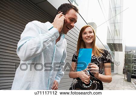 Business people talking on street View Large Photo Image Stock Image - Business people talking on street. Fotosearch