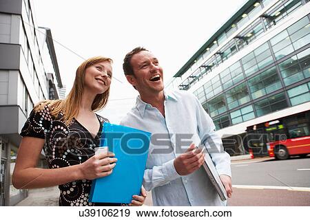 Stock Photo - Business people talking on street. Fotosearch